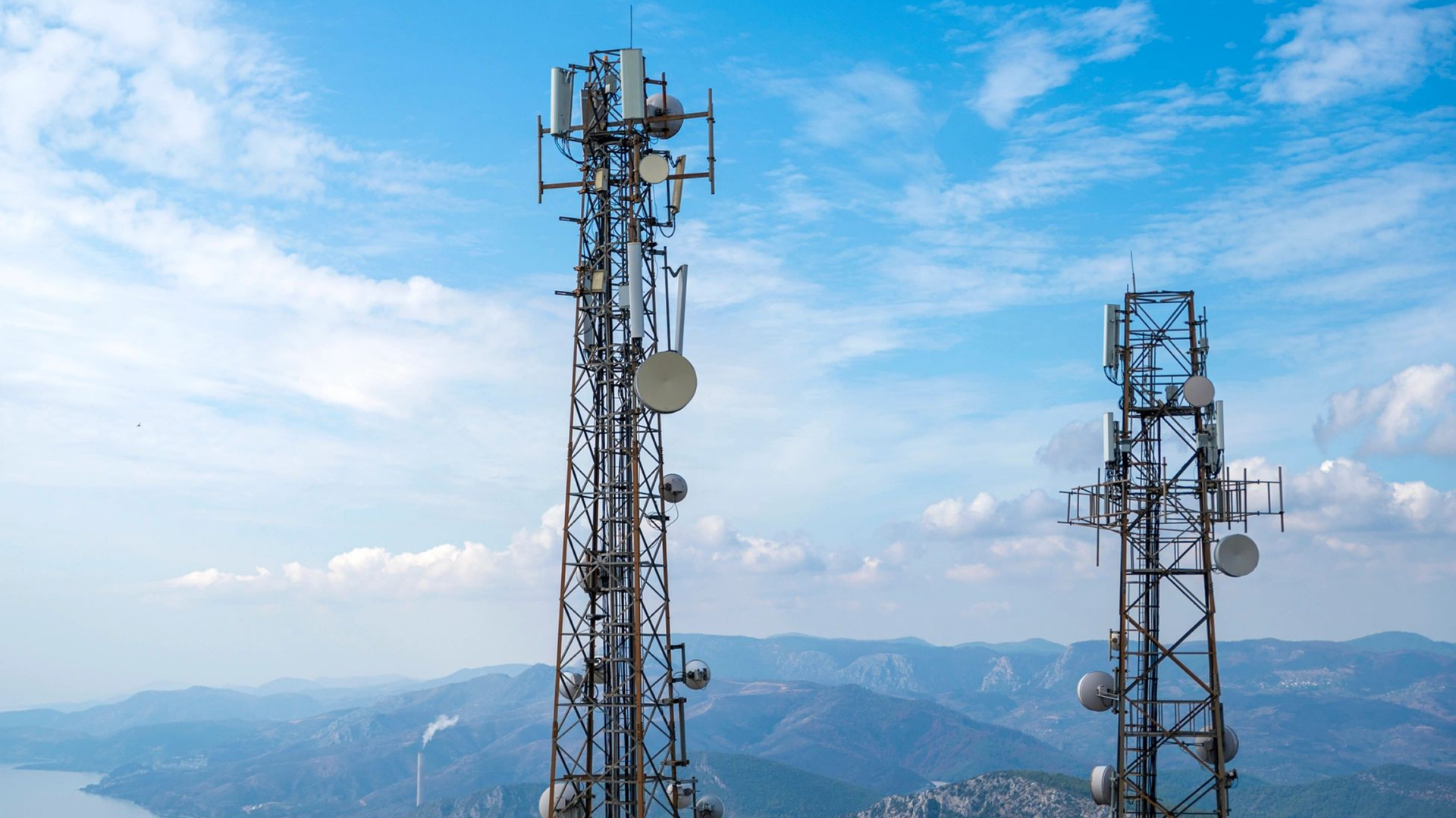 Cell towers under blue sky